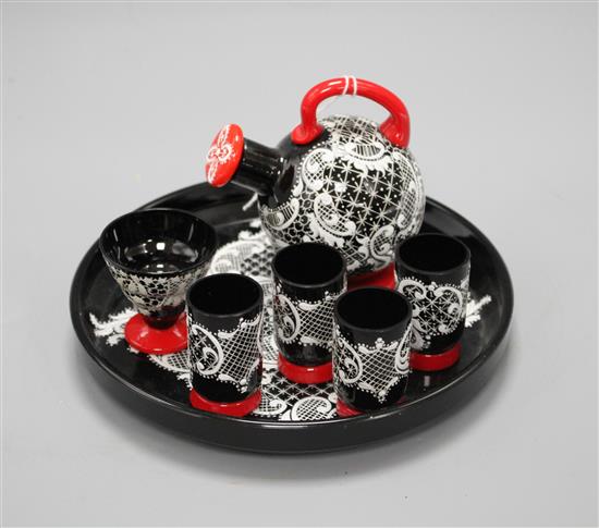 A Murano seven piece glass liqueur set, with lacework decoration, tray diameter 18cm